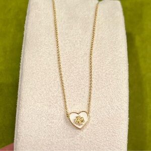 Tory Burch Kira Heart Pendant Necklace with an 18k gold-plated brass chain